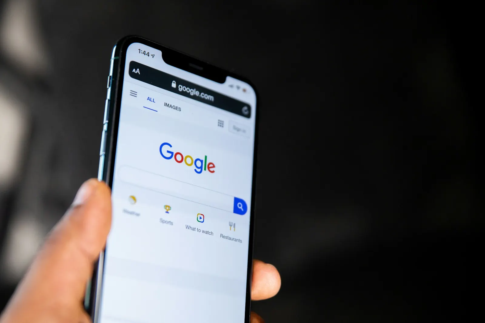 Customer searching Google on a phone for a local Airdrie business