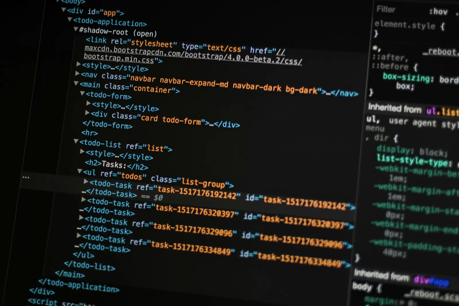 Website code on a monitor during a technical SEO audit for an Airdrie business