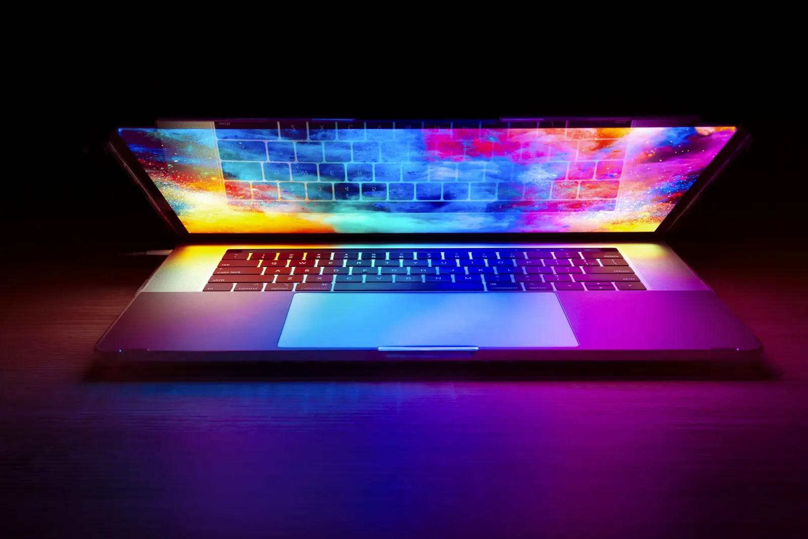 Laptop with a vibrant website design glowing on screen, Airdrie web design