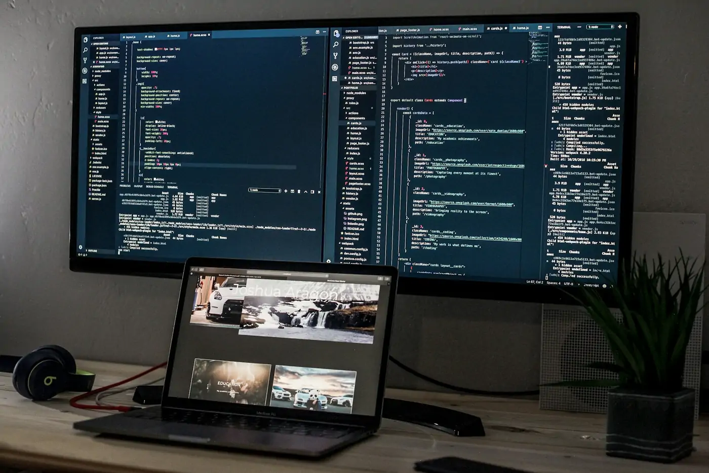 Developer workspace with a wide monitor and laptop for website hosting and care plans in Airdrie